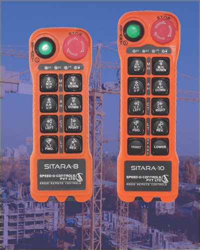 Two orange crane remote controls